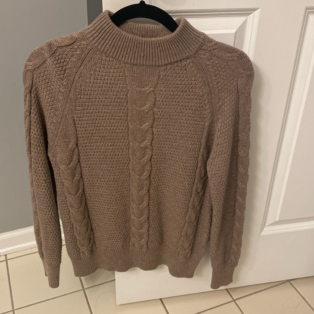 Light brown sweater.